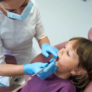 Child visiting a children's dentist in Garden City for dental care